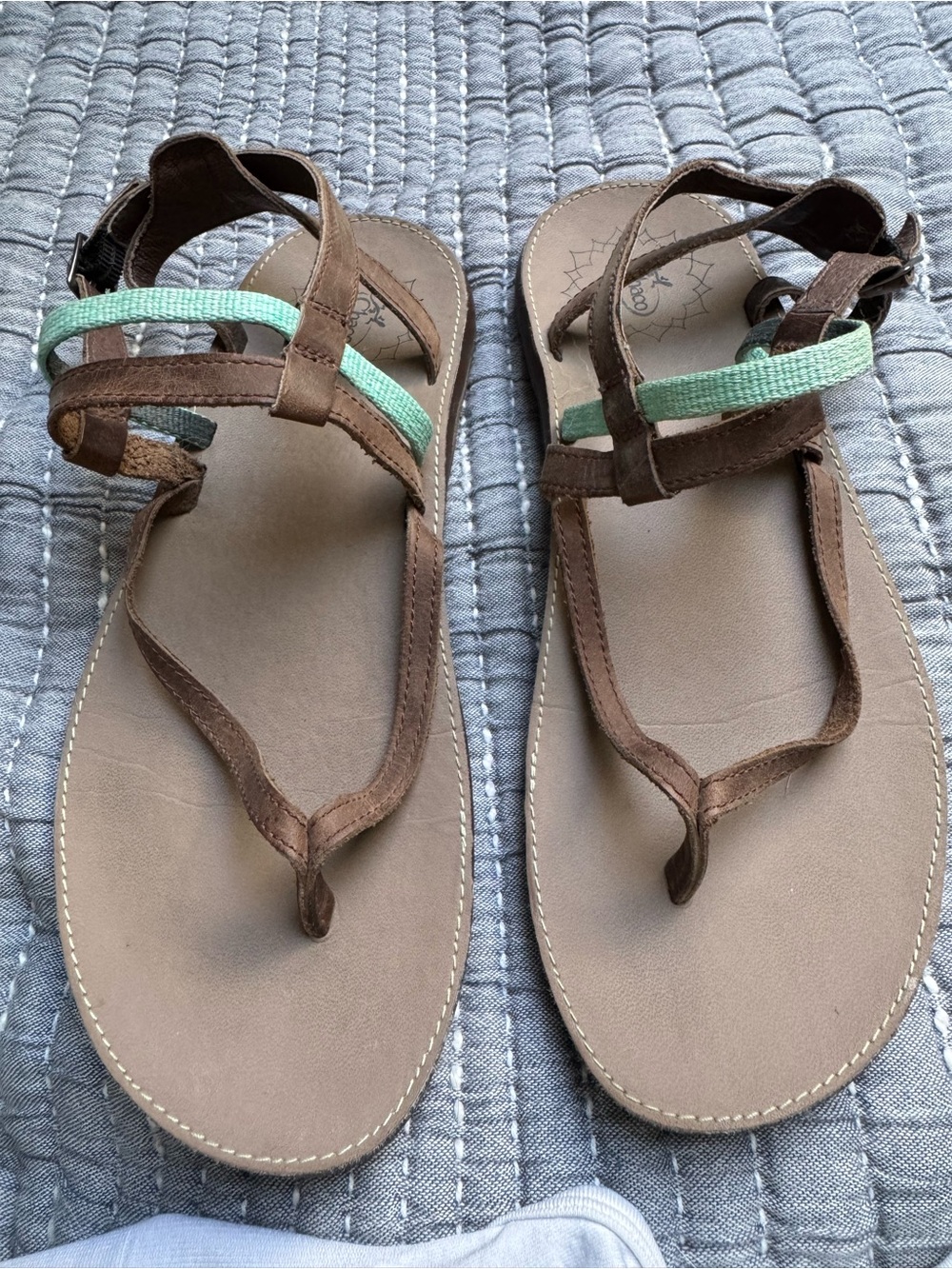 Chaco’s Brown Leather Sandals with turquoise and brown straps